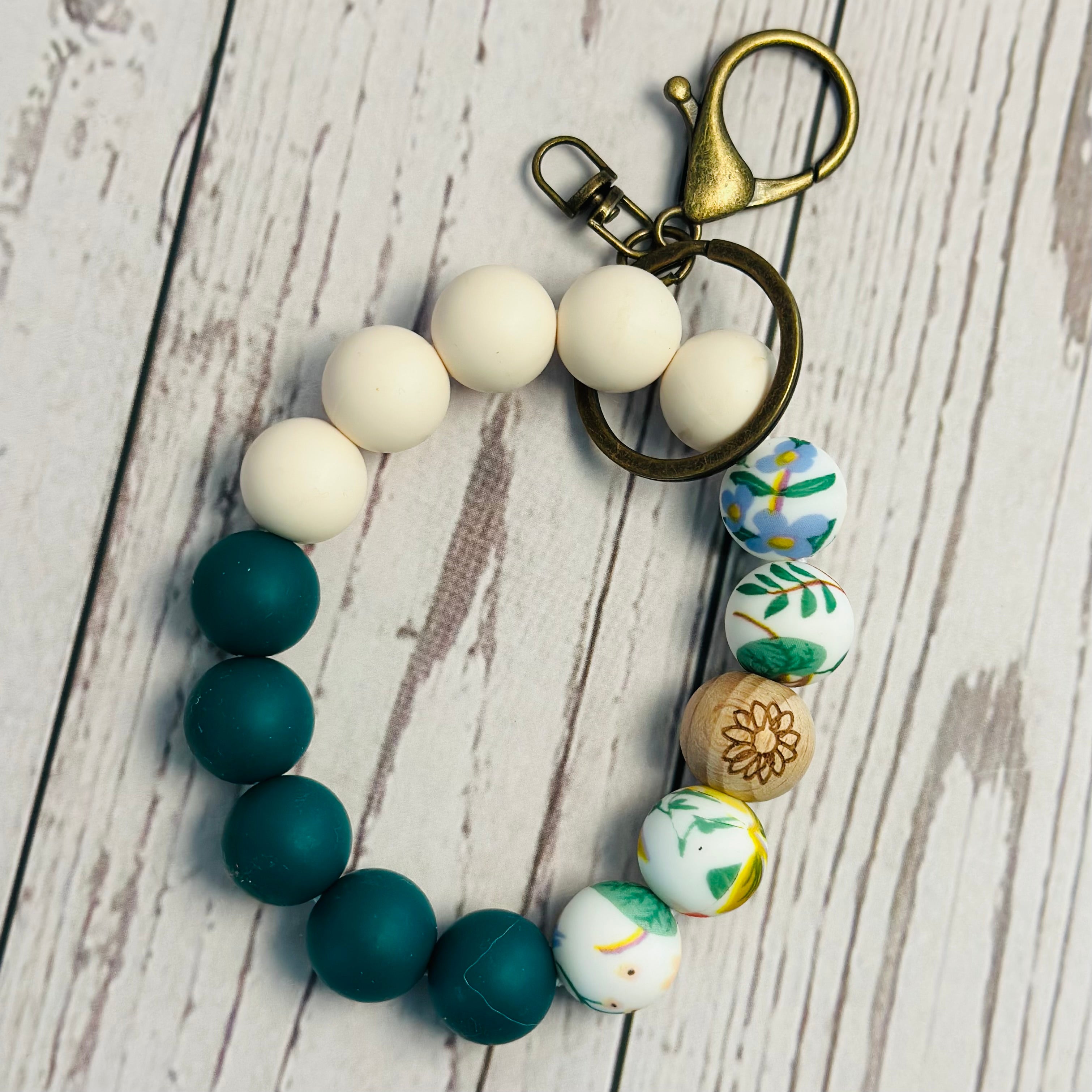 Keychain with colorful beads on a wooden surface